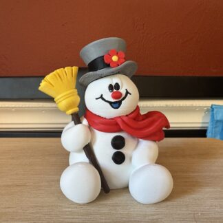 Bring the magic of winter indoors with your very own Frosty the Snowman figurine!
